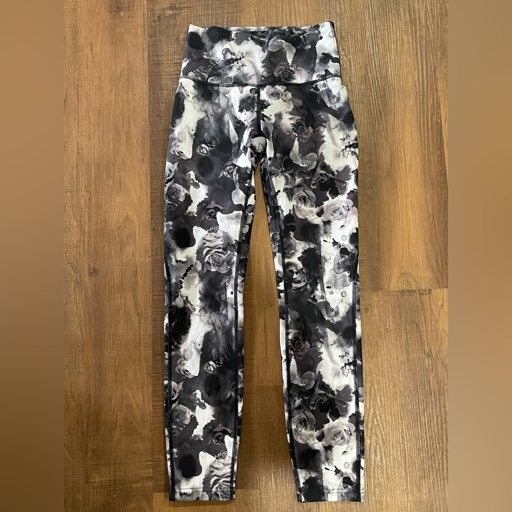 Lululemon size 4 rose leggings. In used condition but still has much life left!